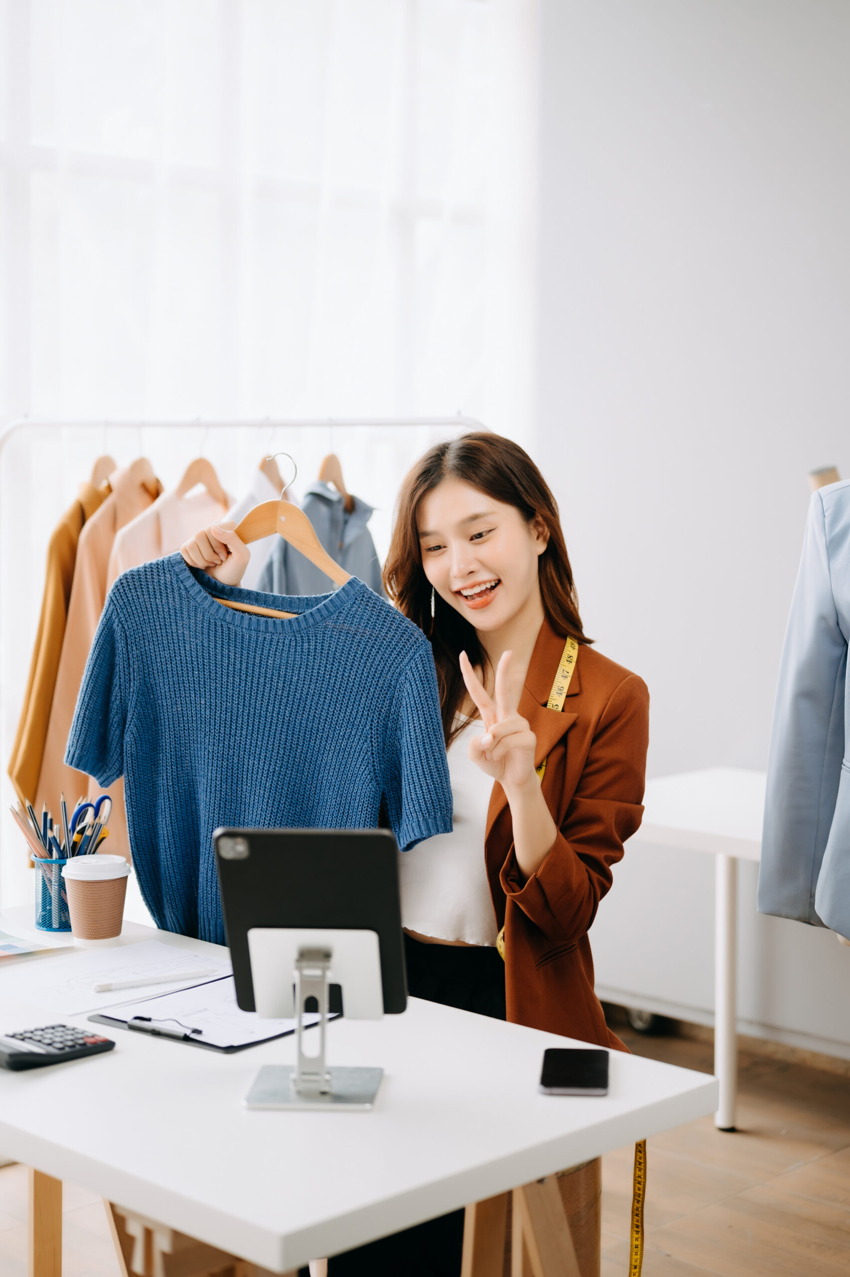Fashion blogger concept, Young Asian women selling clothes on vi